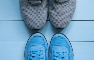 two pairs of sport sneakers toe to toe
